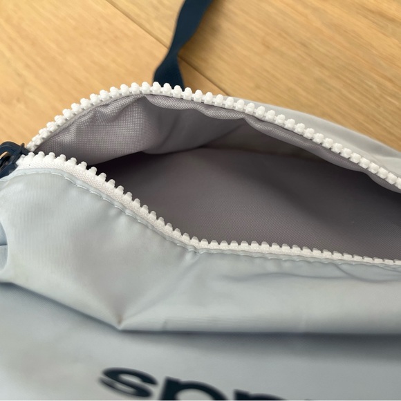 Light blue and navy champion backpack with little stain on the bottom - Picture 8 of 8